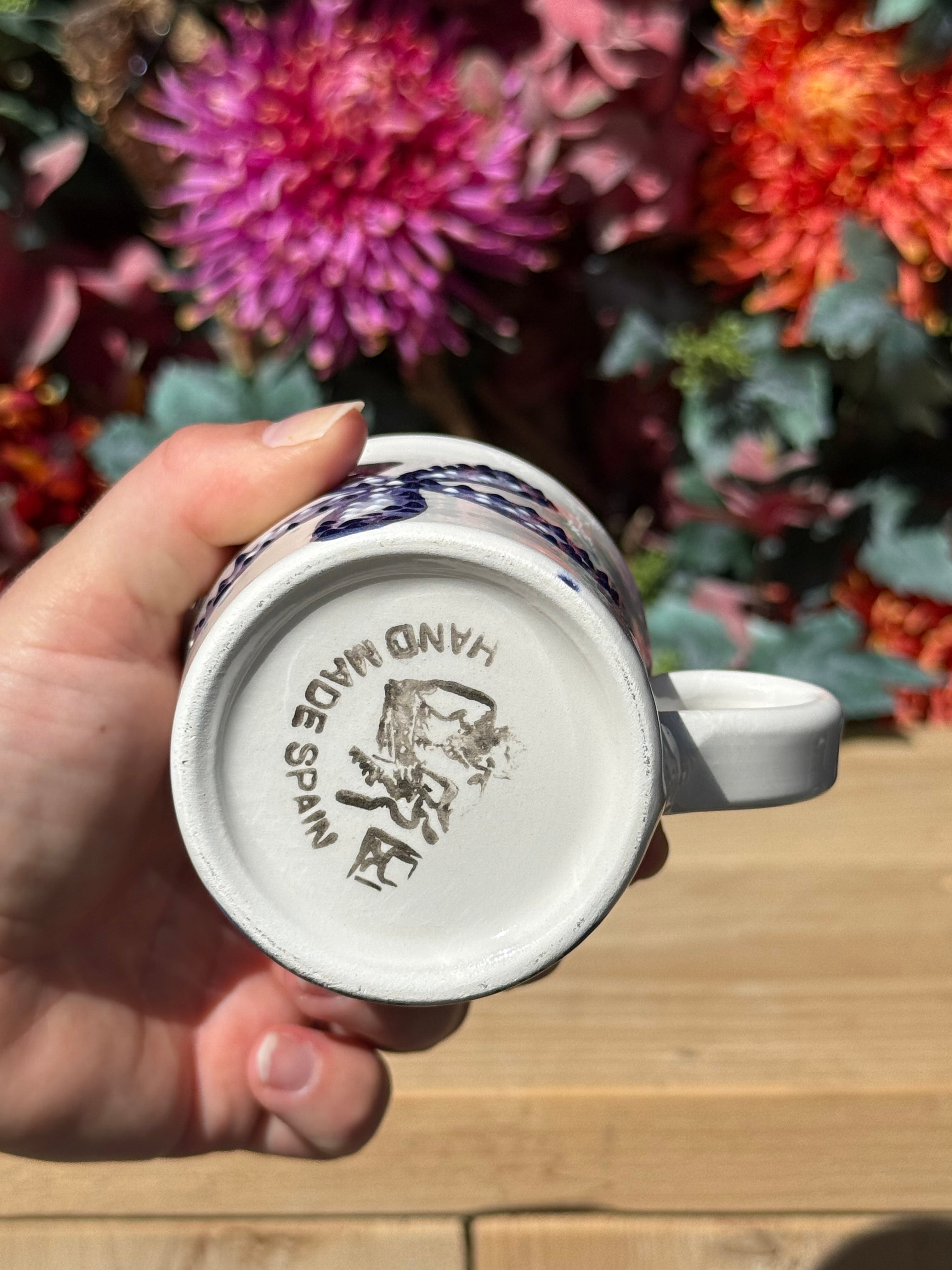 Keramieken koffiekop koraal achterkant logo